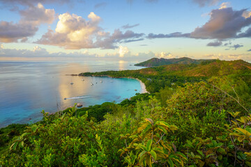 sunset at tropical beach anse lazio on praslin on the seychelles