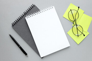 top view of open notepad and yellow sticker with copy space. memo and planning concept. glasses. pen