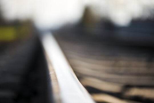 macro photo of tracks, close-up of train tracks, in landscape background, nice sunny weather, statistics, mortality