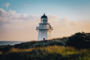 Lighthouse on the coast at sunset