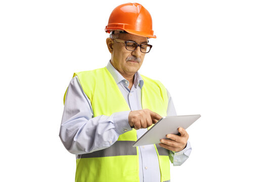 Mature construction site engineer using a tablet