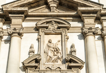 Obraz premium Detail of the façade of the church of San Giuseppe, Baroque-style Roman Catholic church built in 17th century near La Scala Theater, Milan city center, region of Lombardy, Italy.