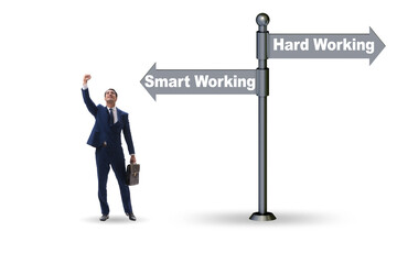 Businessman at the crossroads on working smart or hard