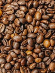 Background of roasted coffee beans close-up view from above.  Coffee beans close-up.