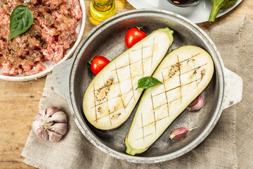 Stuffed eggplant ready to bake with ground meat, vegetables, and spices