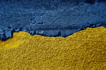 Ukrainian flag on textured wall. Putin invasion. War against Ukraine