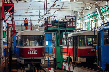 Trams in service depot. Maintenance and repairing of trams