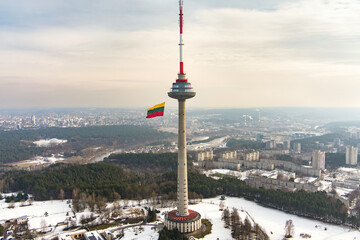 VILNIUS, LITHUANIA - FEBRUARY 16, 2022: Giant tricolor Lithuanian flag waving on Vilnius television...