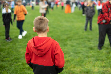 Children at sports tournament. Playing in park. Schoolchildren play sports. Health Day in Russia.