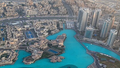 Panorama of buildings and fountains in the city of Dubai from the Burj Khalifa, the tallest...