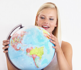 Ah, heres a place I havent explored yet. A pretty young woman looking at a globe of the earth.