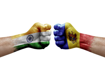 Two hands punch to each others on white background. Country flags painted fists, conflict crisis concept between india and moldova