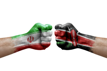 Two hands punch to each others on white background. Country flags painted fists, conflict crisis concept between iran and kenya