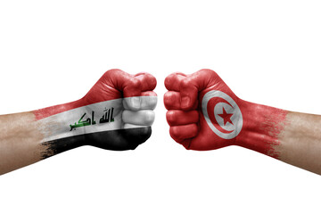 Two hands punch to each others on white background. Country flags painted fists, conflict crisis concept between iran and tunisia