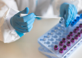 Process of coronavirus PCR antigen testing examination by nurse medic in laboratory lab, COVID-19 swab collection kit, test tube for taking OP NP patient specimen sample, patient receiving test