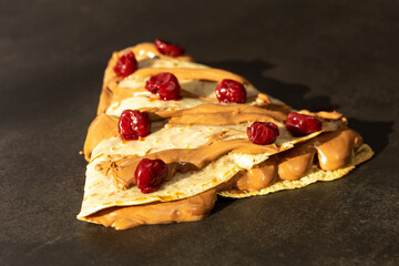European pancake with chocolate cream and cherries