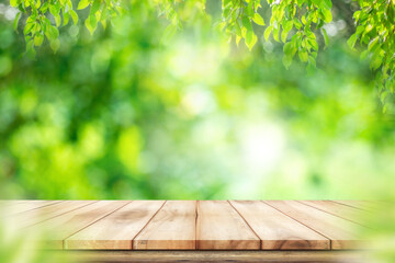 Empty wooden table with garden bokeh background with a country outdoor theme,Template mock up for...