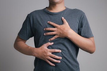 Men have symptoms of burning sensation in the middle of the chest caused by acid reflux. /Health...