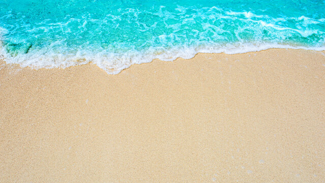 Summer beach background / sea wave on the sand for a space for you to enter text.. © kanachaifoto