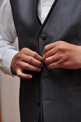 businessman adjusting his tie