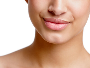 Her smile can charm anyone. Closeup studio shot of a beautiful young womans mouth.