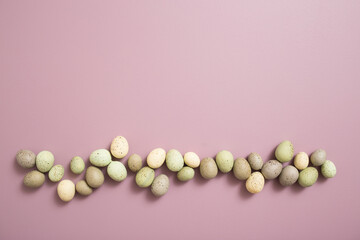 Easter Eggs on Purple Pastel Background with White Space