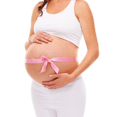 Shes expecting. Cropped shot of a pregnant woman isolated on white.