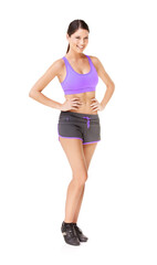 Looking like this takes a lot of work. Full length portrait of a fit young woman in gym clothing isolated on white.