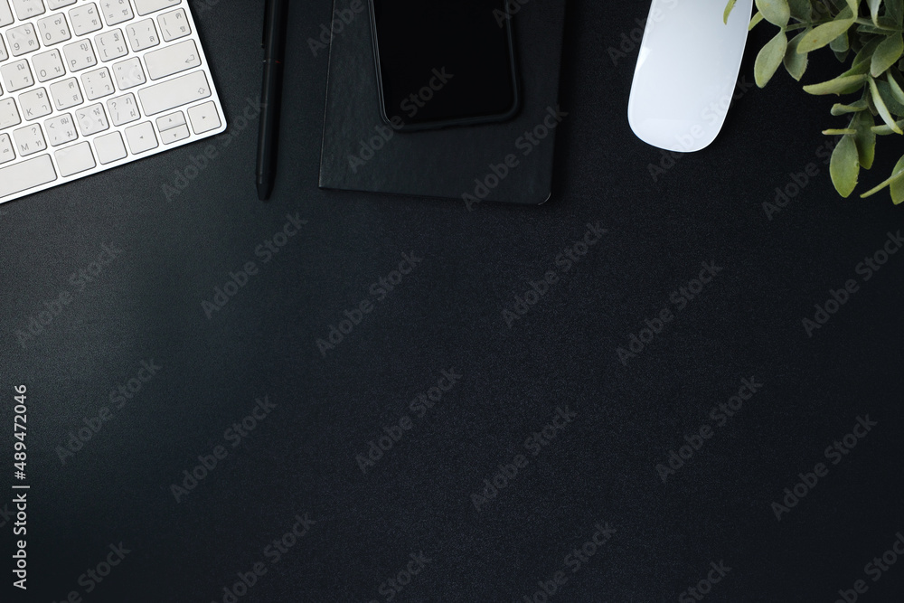 Aufkleber top view working desk with keyboard mouse and notebook on black table background
