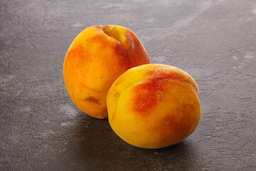 Two Sweet ripe tasty peaches
