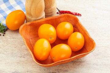 Sweet ripe yellow tomato in the bowl
