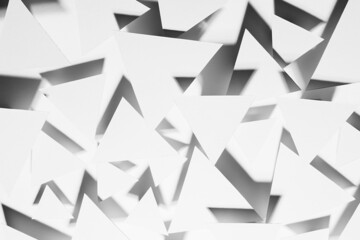 White paper triangles as energy cocky abstract random pattern in bright light with black strict shadows, sharp angles, top view. Contemporary simple abstract background.