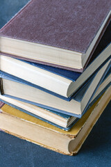stack of books on a blue background