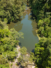 Fototapeta na wymiar Drone aerial of Broken River flowing through dense national park.