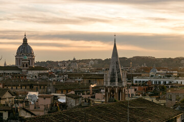 Fototapeta na wymiar Panoramic view from the Pinicio viewpoint of Rome Italy, in the middle of an intense orange sunset