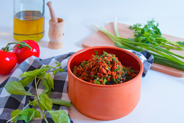 Kisir, Bulgur wheat as a salad prepared with tomato paste, fresh tomatoes, parsley, olive oil. 