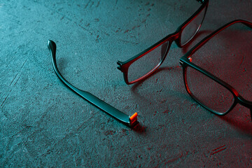 eyeglasses. old broken and new.