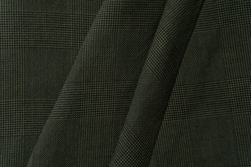 Fototapeta premium Green plaid fabric background close up 