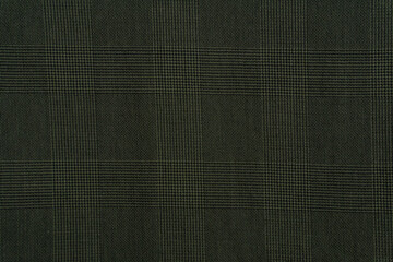 Fototapeta premium Green plaid fabric background close up 