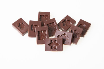 black chocolate square in top view in white background