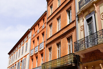 Fototapeta na wymiar red building facade in heart of old city of Toulouse Haute-Garonne France