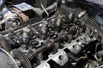 Selective one of engine injector of car. Open the lid for maintenance and cleaning of soot.
