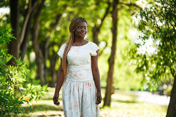 Young Attractive Black Skin Woman, Afro Hairstyle, In nature Background