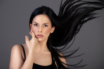 Young Girl with Long Flying Hair, Grey Background