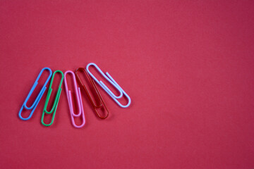 on red paper, paper clips should be red blue green pink white