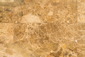 Fototapeta na wymiar Texture of stone marble. Brown surface of marble stone with striped streaks..