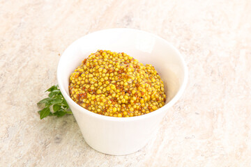 Grain mustard sauce in the bowl