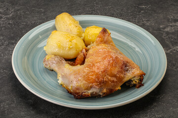 Roasted chicken leg with potato