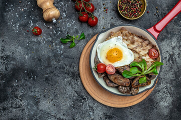 Baked sweet purple potatoes, grilled bacon and fried egg in pan and coffee on white background. Keto breakfast or lunch. Healthy fats, clean eating for weight loss, top view