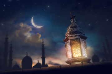Ornamental Arabic lantern with burning candle